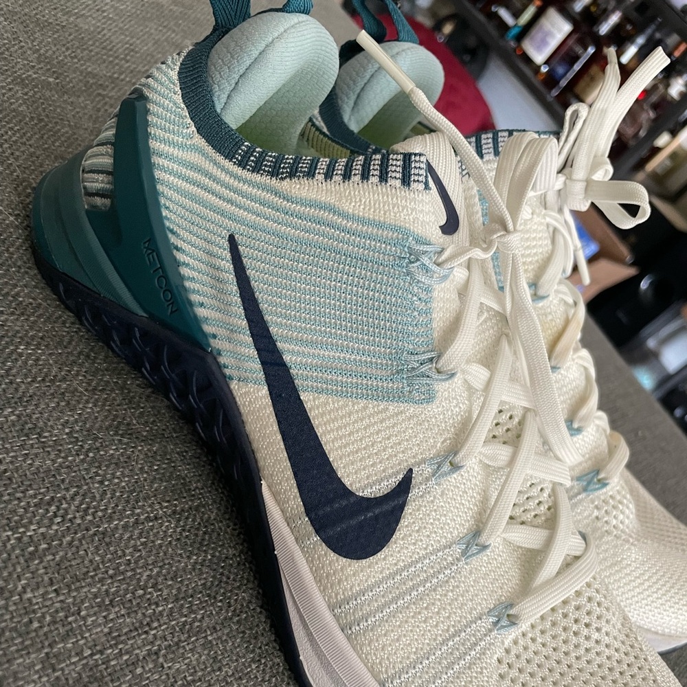 Nike Metcon flyknit. Worn once. Discoloration on inner side of one shoe